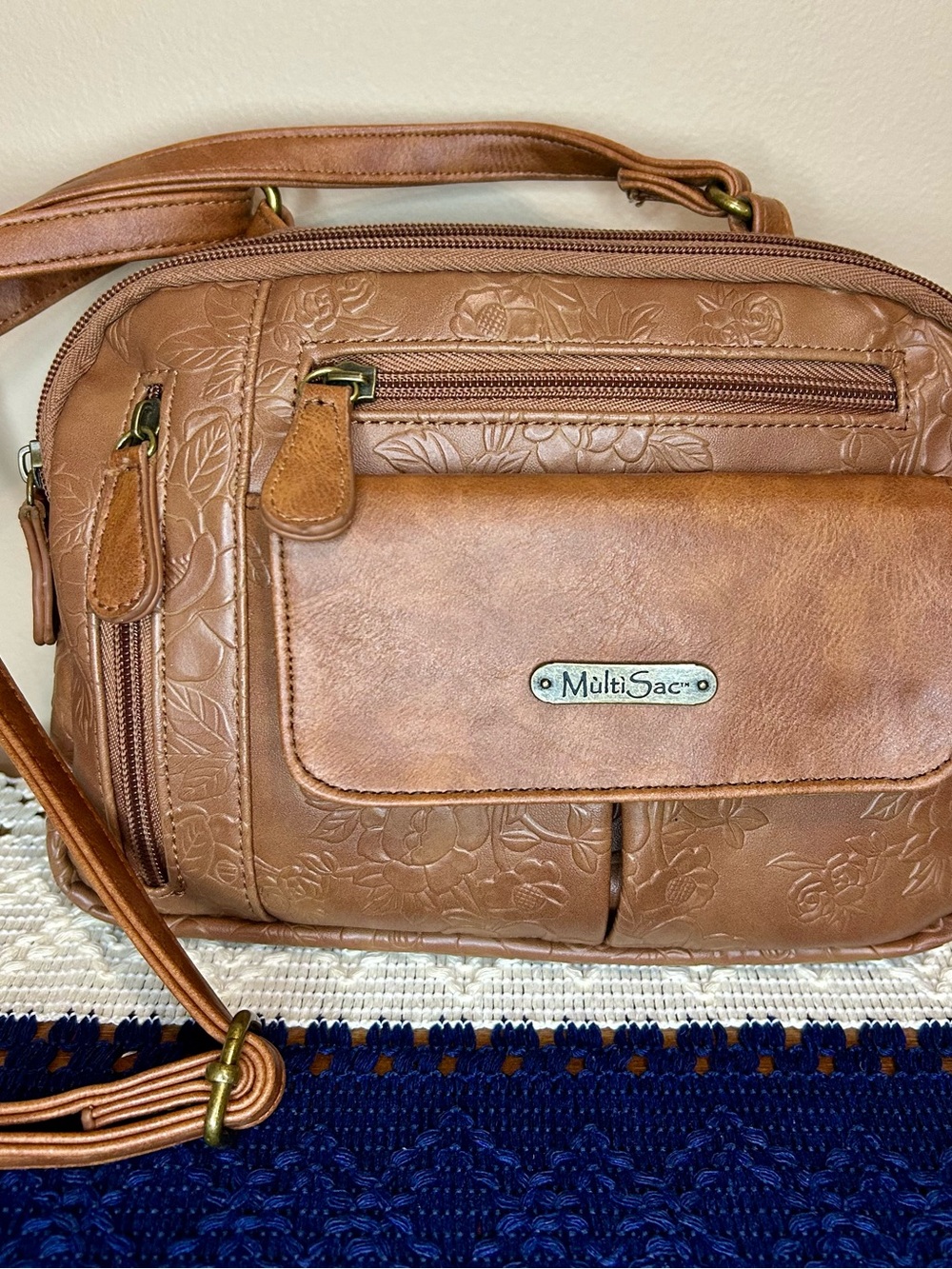 MultiSac Tan Floral Embossed Crossbody Bag